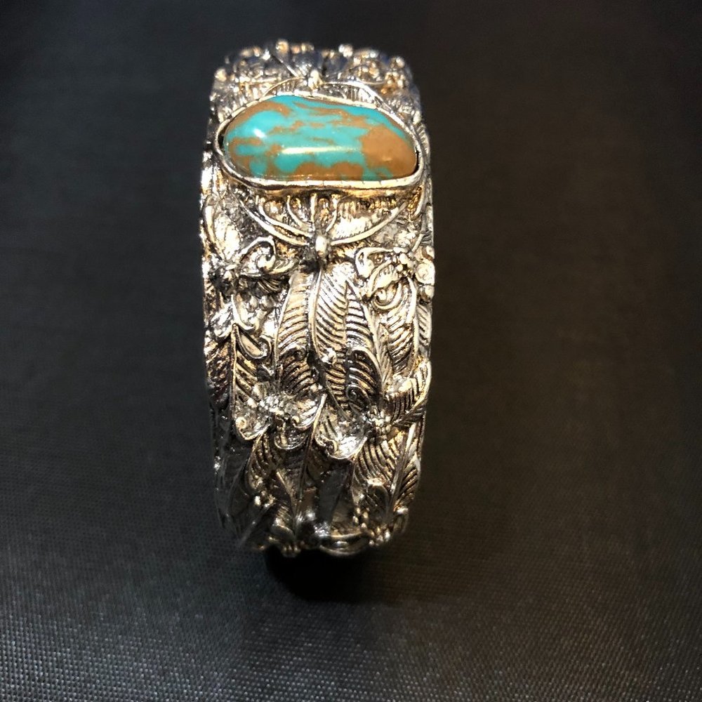 Tibetan Silver Turquoise Bracelet has a Adj. band.